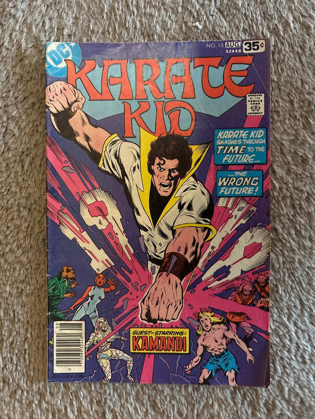 Karate Kid #15 front cover, DC Comics August 1978, Karate Kid smashing through time, guest-starring Kamandi