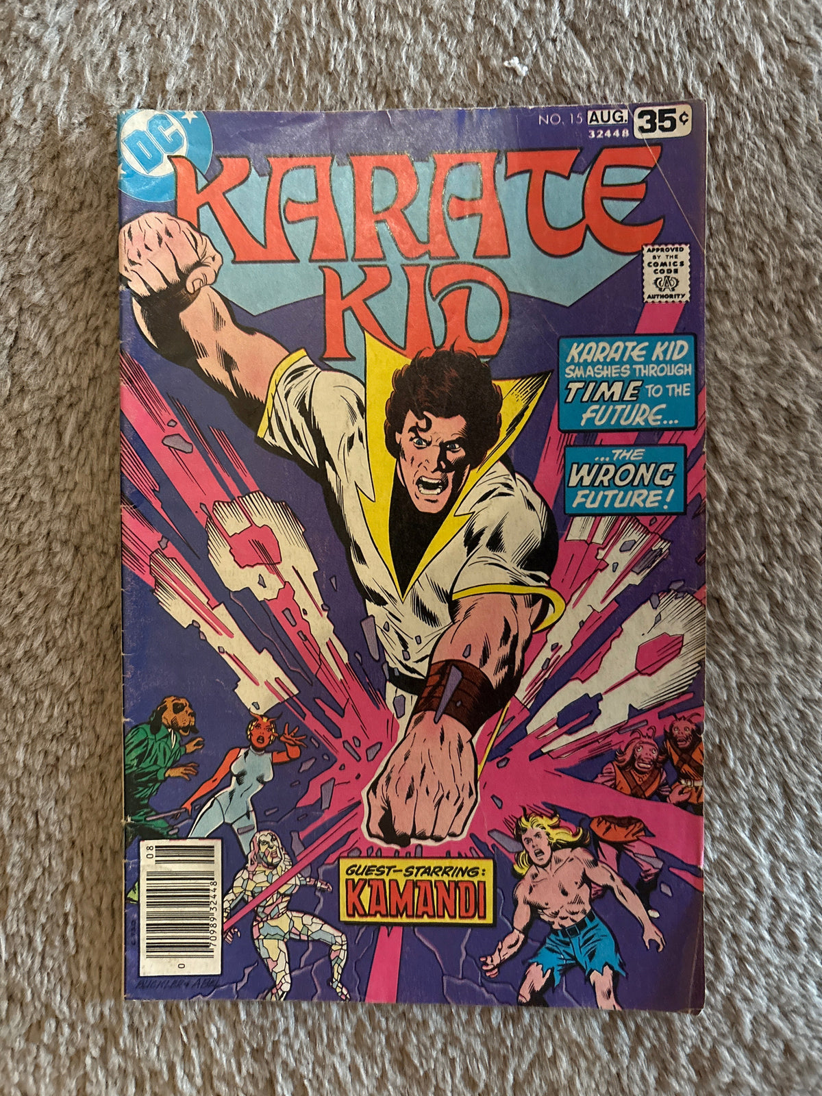 Karate Kid #15 front cover, DC Comics August 1978, Karate Kid smashing through time, guest-starring Kamandi