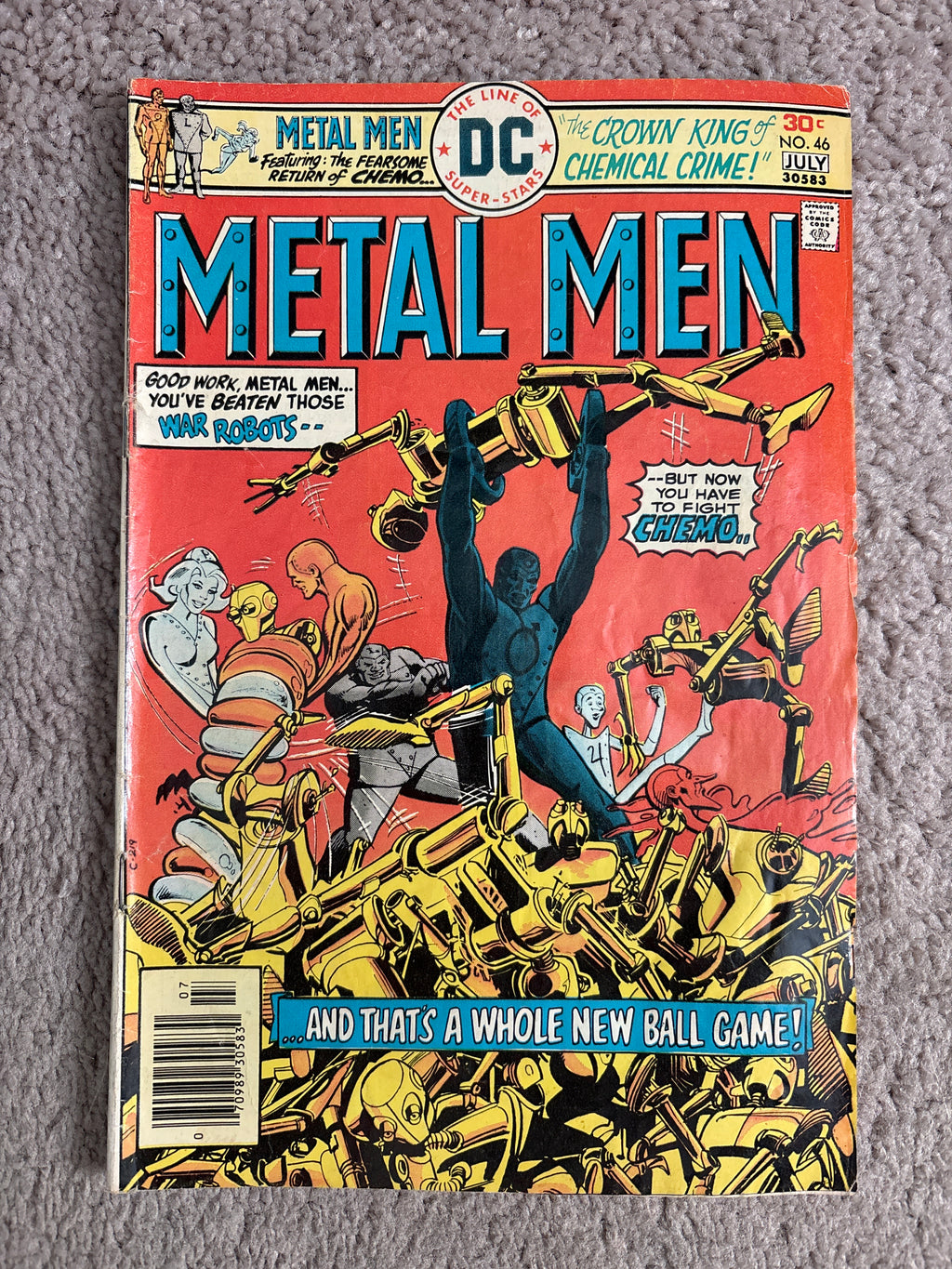 Front cover of DC Comics Metal Men #46, with Metal Men battling robots.