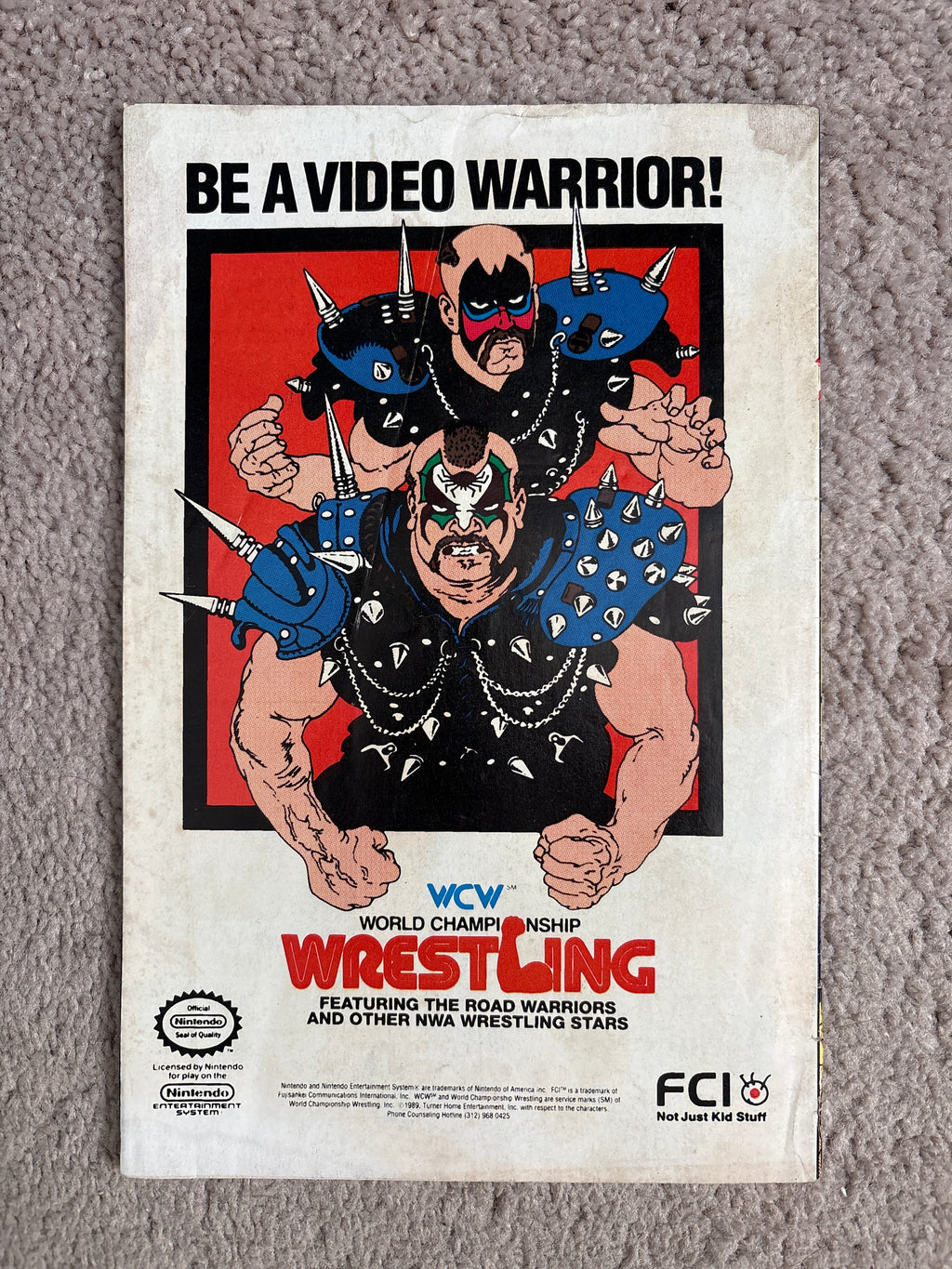 Back cover of Starman #35 featuring a WCW World Championship Wrestling Road Warriors advertisement.