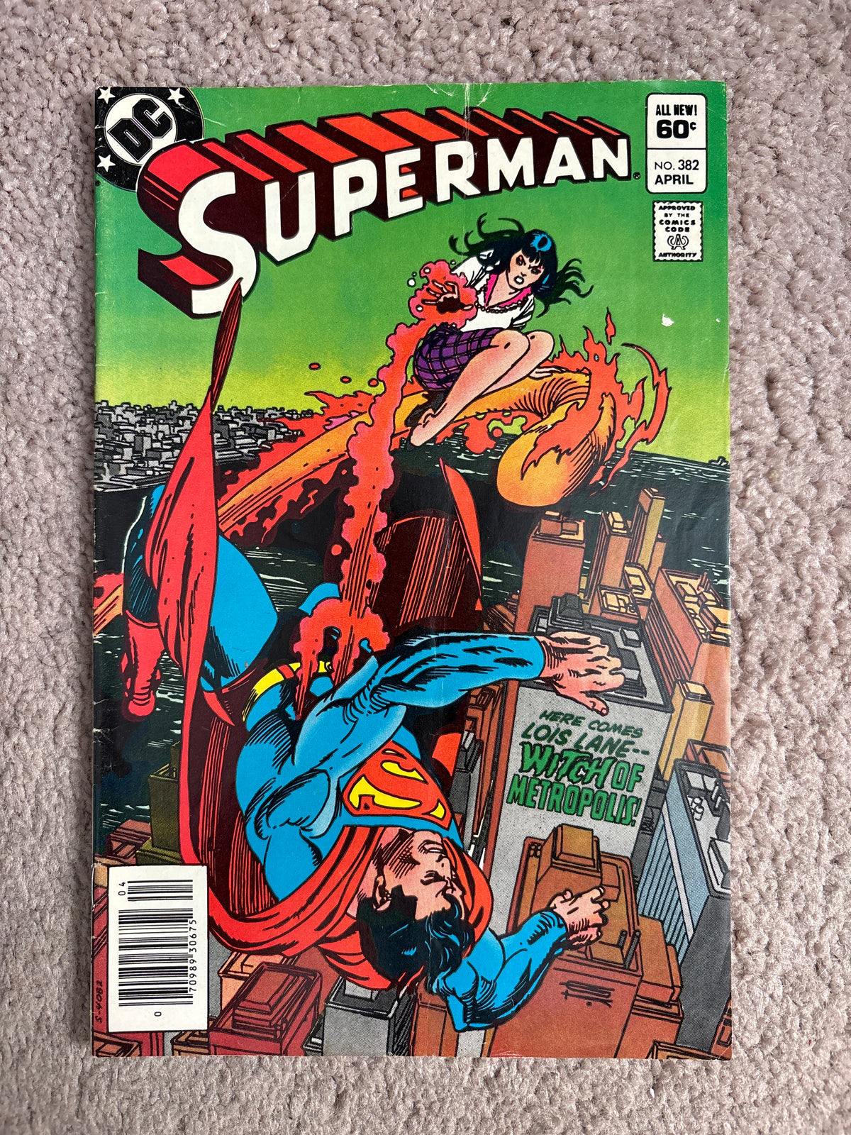 Front cover of Superman #382, April, showing Superman and Lois Lane above Metropolis