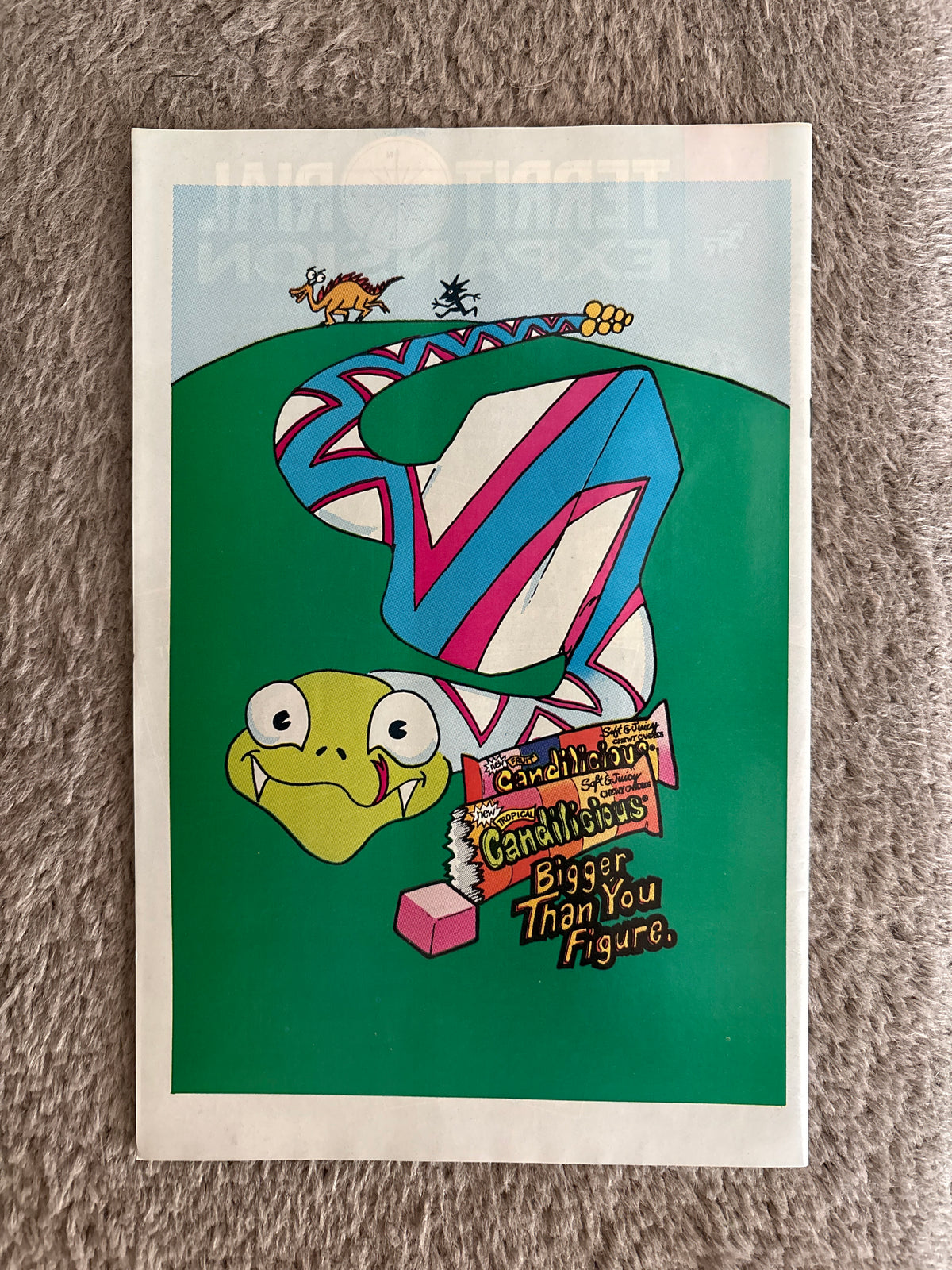 Back cover of X-Factor issue 33 with a colorful candy advertisement