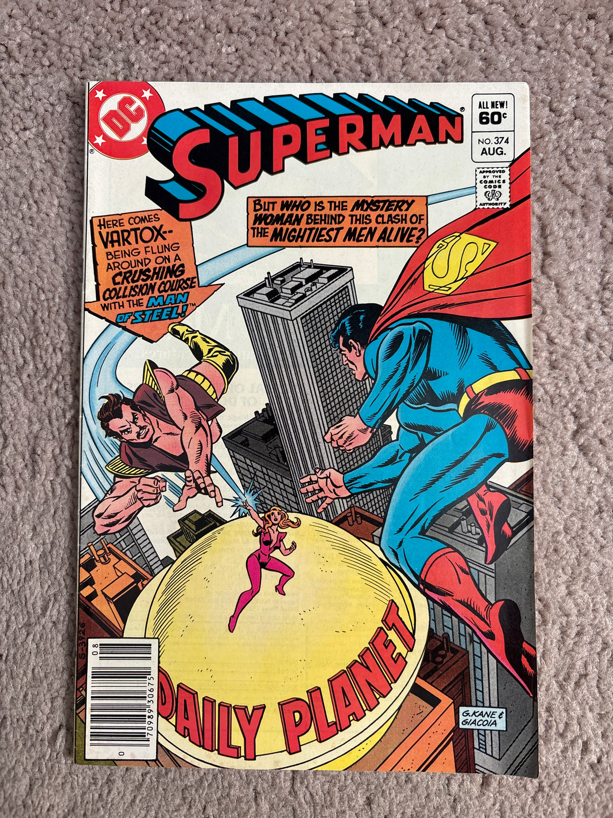 Front cover of Superman #374 showing Superman, Vartox and a mystery woman above the Daily Planet